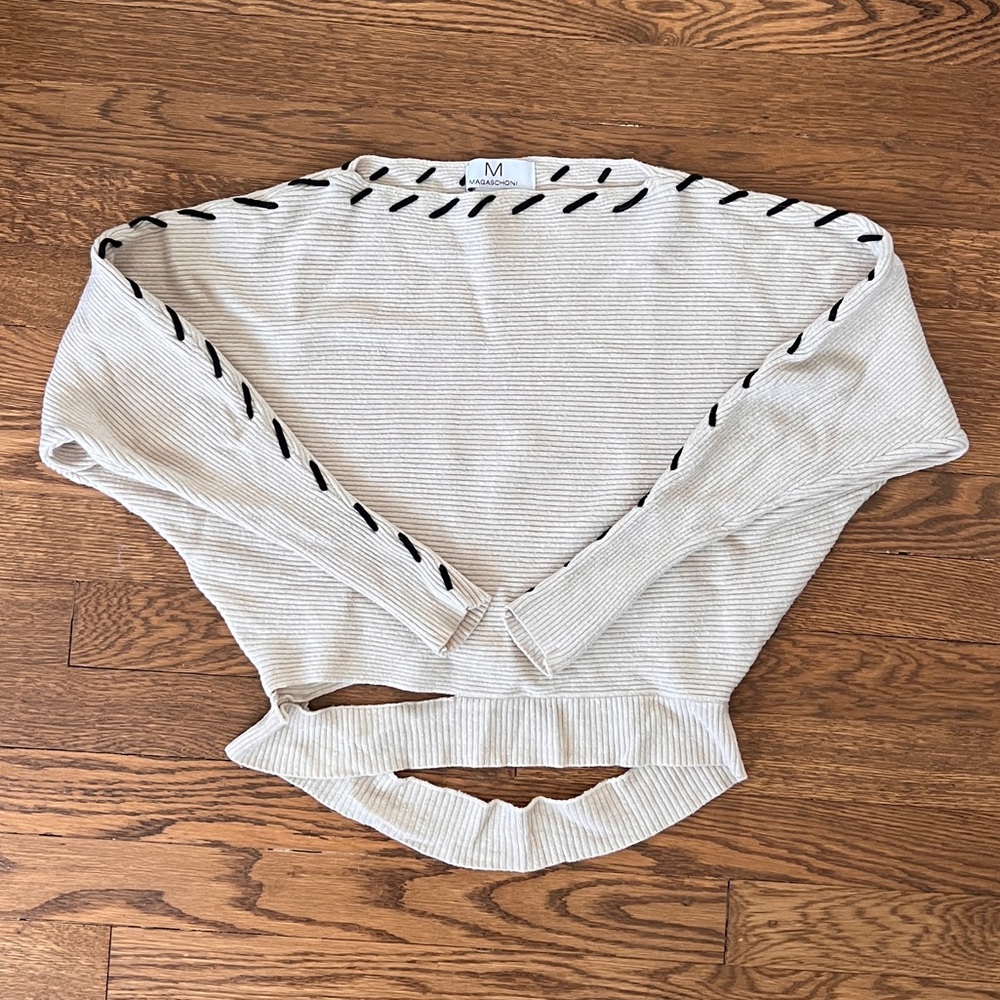 Magaschoni Cream Cropped Knit Top with Black Whipstitch Detail and Cutouts